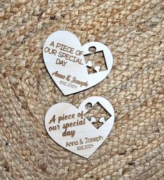 two wooden heart shaped magnets with the words a piece of our special day on them