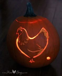 a carved pumpkin with a chicken on it