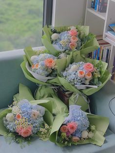 a bunch of flowers sitting on top of a blue chair