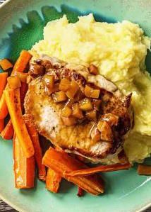 pork chops, mashed potatoes and carrots on a plate