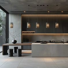 a modern kitchen with an island and counter tops