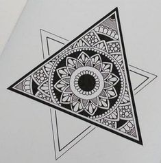 a drawing of a black and white triangle with an intricate design on it's side