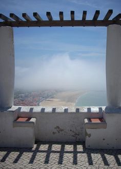 a view from the top of a building looking out over a beach