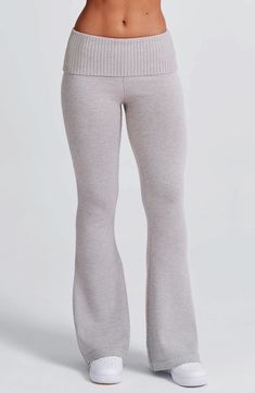 The Portia Knit Pants are a must-have for any wardrobe. These versatile pants feature a flattering fit and flare silhouette. with a wide rib waistband for added style. Complete the look with the matching Portia knit hoodie.   Colour: Light Grey Marl. Regular length. Unlined. Fit and flare silhouette. Wide 2x2 rib waistband. Fold over waistband detail. Internal elastic in waistband. Model is an XS and is wearing an XS. Homecoming Dresses Corset, Pink Monochrome, Midi Dress Wedding Guest, Maxi Dress Sale, Sparkle Dress, Maxi Dress Navy, Colour Light, Dresses By Length, Winter Clothing