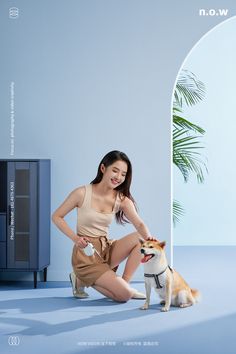 a woman kneeling down next to a dog