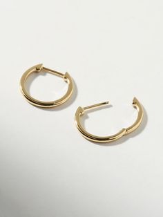 Classic, polished and minimalist-chic, these small slim endless hoops are perfect for everyday wear. Crafted in recycled Sterling Silver and dipped in 14K gold, these hoops come with an endless hoop closure for comfort and ease. Lightweight and hypoallergenic, these small slim endless hoops add a dainty touch to your earring stack. This design is also available in a medium size. • Hypoallergenic hoop earrings crafted in recycled Sterling Silver• High-polish, smooth 14K gold finish • Lightweight, Earring Stack, Bday Gift, Outfit Plan, Minimalist Chic, Earring Crafts, Letter Necklace, Simple Earrings, Recycled Sterling Silver, Gold Finish