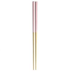 two pink and gold chopsticks sitting next to each other