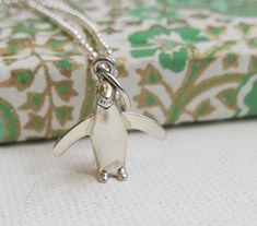 This listing is for **ONE Sterling Silver Penguin charm Necklace**  ✦Length of chain is 18 inches.  ✦length of pendant is 23mm. ✦Metal: sterling silver (925) This will be sent from Norway I have  real passion for beautiful embellishments, wearable design and gorgeous handmade jewellery. I am inspired by exotic cultures, exquisite stones and the essential colours of nature.  I showcase a unique fusion of colored gemstone jewellery,  modern yet timeless design and masterful craft techniques to create unique gemstone jewellery for everyday modern women. Each  piece is handmade using the finest gemstones, sterling silver and 18 carat gold plating, so you can have the look and feel of fine jewellery for any occasion. Please be aware that each item is made by human beings and not by machines. Th Handmade Gifts For Women, Colours Of Nature, Penguin Necklace, Craft Techniques, Gemstone Jewellery, Modern Women, Unique Gemstones, Friendship Gifts, Handmade Jewellery