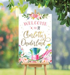 a welcome to charlotte's onederland sign on an easel