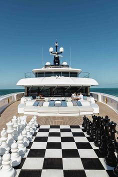 a checkered chess board on the deck of a yacht