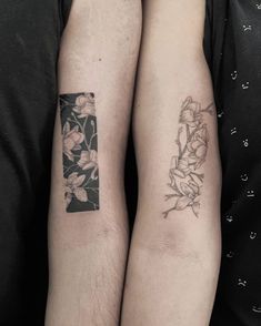 two people with matching tattoos on their arms