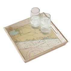 two glasses and a map on a tray