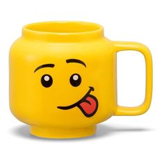 a yellow mug with a face drawn on it