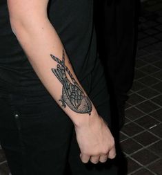 a person with a tattoo on their arm