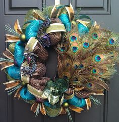 a wreath with peacock feathers and balls on the front door