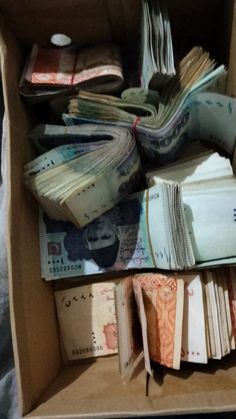 an open box filled with lots of money