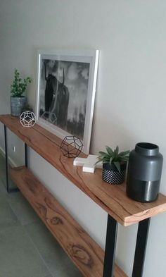 a wooden shelf with some plants on it