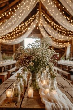 Rustic barn wedding table decoration, fairy lights Rustic Wedding White Flowers, Fairy Lights Wedding Barn, Moody Rustic Fall Wedding, Fairy Garden Reception, Fall Farm Wedding Colors, Wedding Decor Country Rustic, Elegant Rustic Wedding Ideas Decorations, Wedding Venue Ideas Rustic, Rustic August Wedding