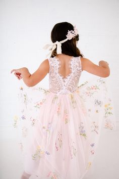 This stunning dress is a beautiful vintage inspired look...perfect for any little girl and occasion! This blush pink  dress has a boho flair and a super feminine feel with the soft vintage inspired lace. This tulle skirt is complete with embroidered florals and butterflies. The V back with unfinished lace and hem creates the perfect amount of bohemian vibes. Nicolette's Couture is a family owned boutique based out of Dubuque, Iowa.  When creating looks, comfort is our main priority...regardless of how chic a style is. We've had amazing success so far and believe our story is just beginning. The future looks bright for Nicolette's, and we're eager for you to hop on board and experience our brand's benefits.  Pair It With A Nicolette's Hairpiece:  https://www.etsy.com/shop/NicolettesCouture? Whimsical Fairy Dress For Spring Dress-up, Summer Princess Dress With Lace Trim For Dress-up, Summer Princess Fairy Dress For Garden Party, Fitted Princess Style Spring Fairy Dress, Pink Fairy Dress For Summer Dress-up, Whimsical Pink Fairy Dress For Spring, Pink Whimsical Fairy Dress For Spring, Spring Party Princess Dress With Embroidery, Spring Party Princess Dress Embroidered