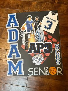 the basketball team's name and numbers are depicted on this sign, along with other sports related items