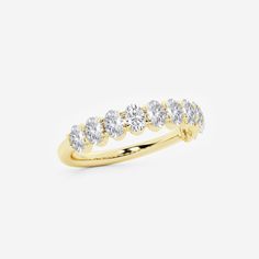 a yellow gold ring with five diamonds