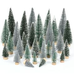 small christmas trees are lined up in rows