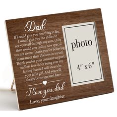 a wooden frame with the words dad on it and a photo inside that reads, i love you dad