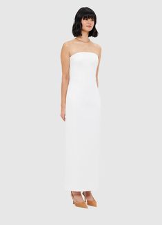 PRODUCT DESCRIPTION Premium textured maxi dressStrapless necklineInvisible side zip closureFitted waistFully lined SIZE & FIT 6 8 10 12 14 16 18 Bust 80 85 90 95 101 107 113 Waist 65 70 75 80 86 92 98 Hip 94 99 104 109 115 121 127 Back length 116 117 118 119 120 120 120 Hem Circumference 87 92 97 102 108 114 120 Amanda is 5’9" (177 cm) and wears a size 8Bust: 31” (82cm) / Waist: 24" (61cm) / Hips: 35” (89cm) Pala is 5’10” (178 cm) and wears a size 12Bust: 39” (99cm) / Waist: 31” (78cm) / Hips: 4 Snow Dress, Year Of The Dragon, Side Zip, Jumpsuit Dress