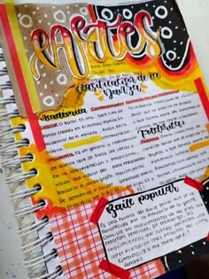 an open notebook with some writing on it