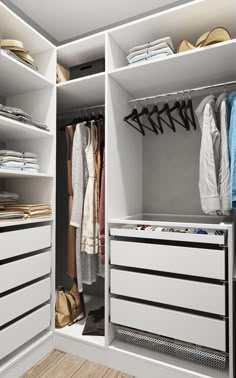 an organized closet with white drawers and clothes hanging on the rails, along with shoes