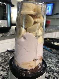 a blender filled with bananas on top of a counter