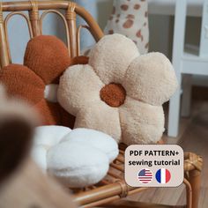 a basket filled with stuffed animals sitting on top of a wooden floor next to a chair