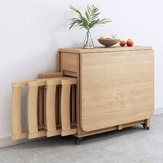 a plant is sitting on top of a wooden cabinet