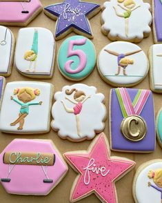 decorated cookies are arranged in the shape of stars and numbers for children's birthdays