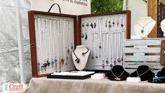 a table with jewelry on display at an outdoor market