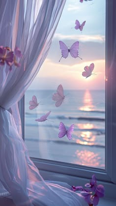 there are many butterflies flying out of the window and on the windowsill in front of the ocean