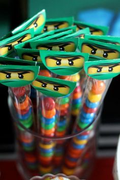 there are many candy sticks with faces on them