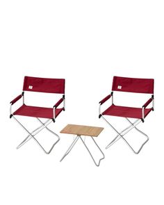 two red chairs and a small table on a white background with one chair facing the other