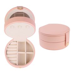 an open pink jewelry box with compartments