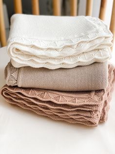 three blankets stacked on top of each other