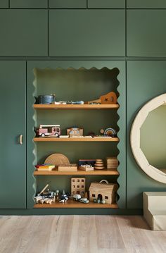 the shelves in this room are filled with toys and other items, including bookshelves