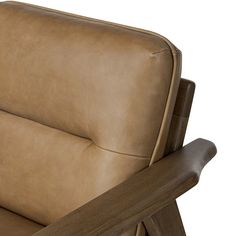 a brown leather reclining chair with wooden arms