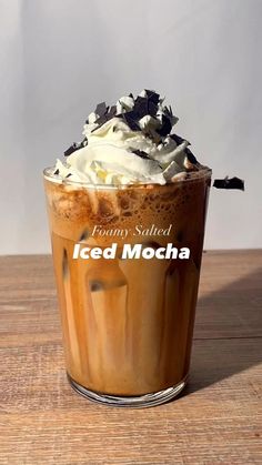 an iced mocha with whipped cream and chocolate sprinkles