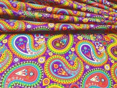 multicolored paisley print on purple fabric