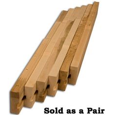 several pieces of wood stacked on top of each other with the words sold as a pair