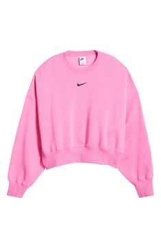 An embroidered Swoosh adds minimal branding to this cozy fleece sweatshirt cut for a relaxed, oversized fit that's enhanced by the dropped shoulders. 22" length (size Medium) Crewneck 80% cotton, 20% polyester Machine wash, tumble dry Imported Cute Sweaters Pink, Nike Crewnecks, Pink Nike Sweatshirt, Jordan Clothes, Nike Phoenix Fleece, Nike Hoodies For Women, Crewneck Outfit, Nike Crew Neck, Cute Nike Outfits