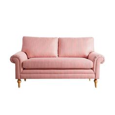 a pink striped couch sitting on top of a white floor