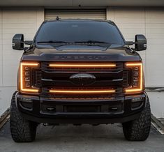 the front end of a large truck with lights on it's grille and headlights