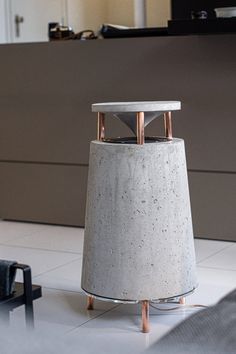 a white table sitting on top of a tiled floor