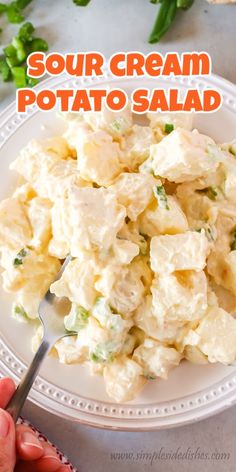 a white plate topped with potato salad on top of a table